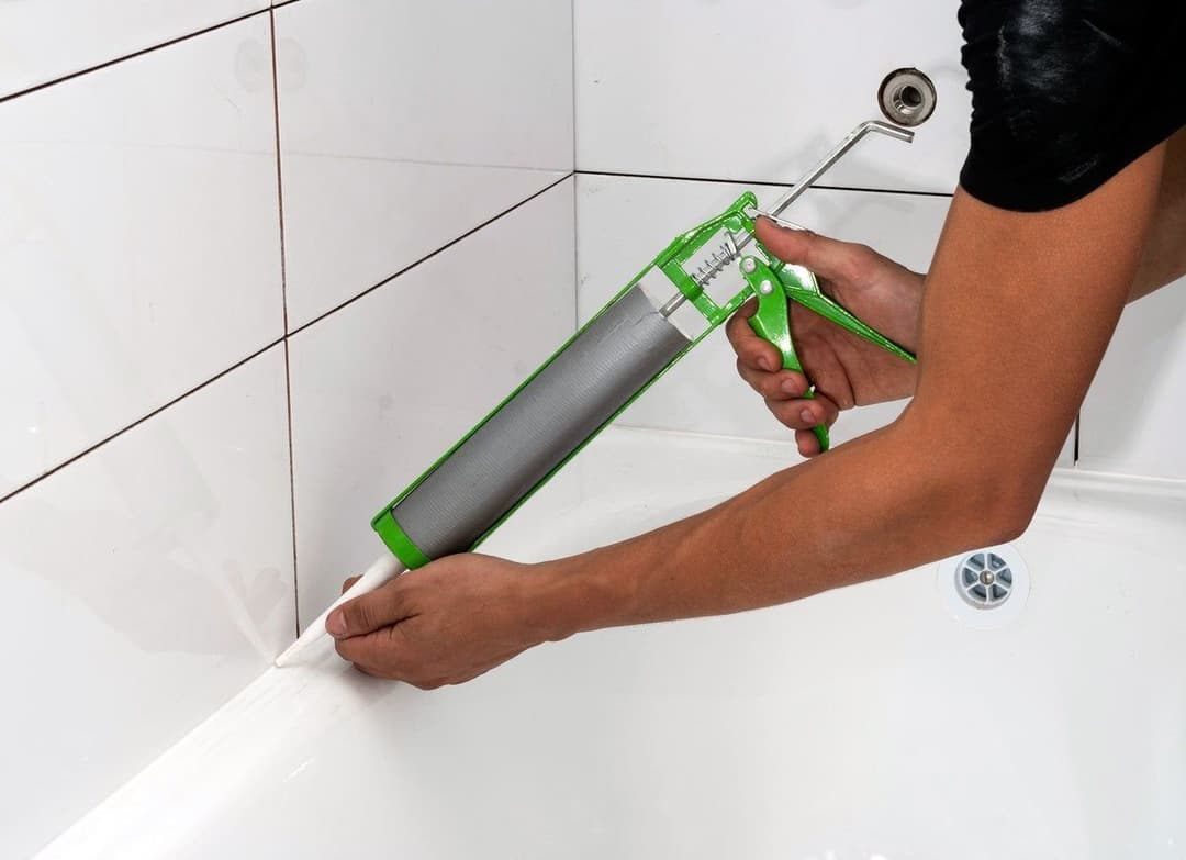 applying-caulking-in-bathtub.jpg