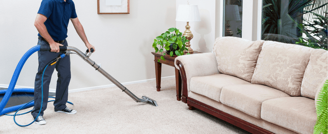 man-vacuuming-in-livingroom.png
