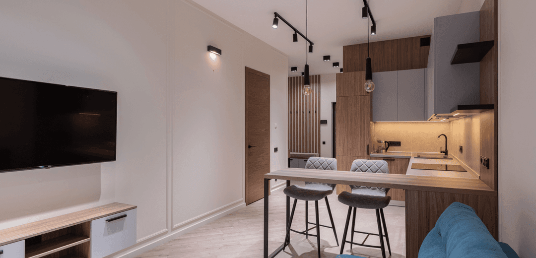 modern-kitchen-in-apartment-with-bar-chairs.png