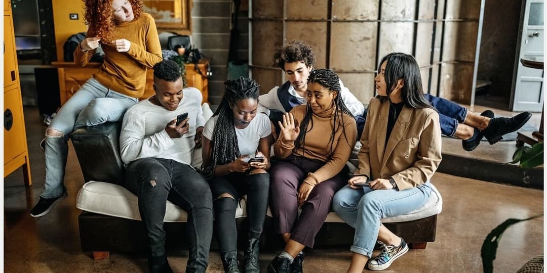six-young-adults-sitting-on-couch.jpg