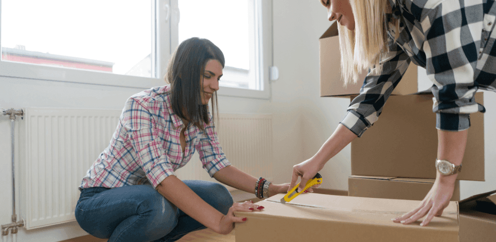 two-people-cutting-moving-box.png