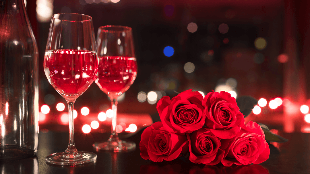 two-wine-glasses-and-roses-at-night.png